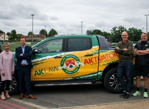 Desing your own vehicle wrap_Employees alongside AK Law wrapped promo vehicle