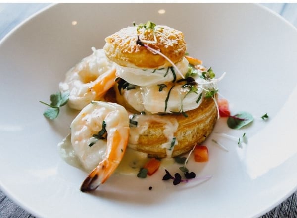 Shrimp, poached egg and puff pastry dish