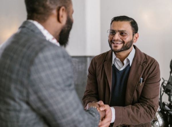 Food Truck Finance - Investor shaking hands with business owner