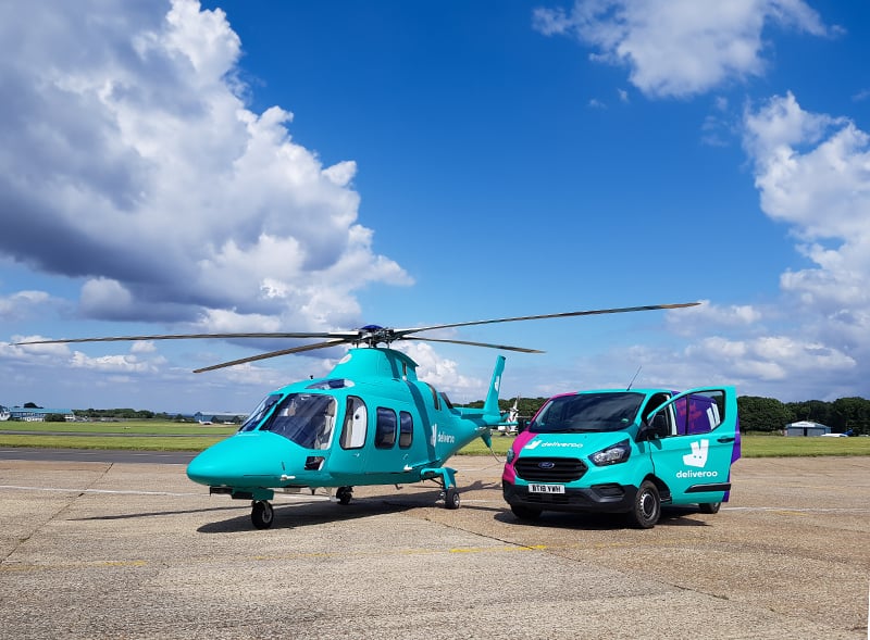 Deliveroo helicopter and van on runway