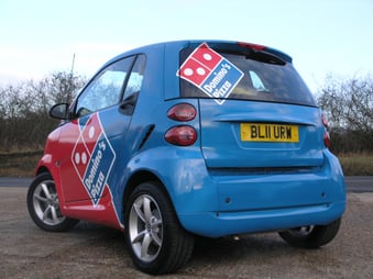 Dominoes branded red and blue smart car