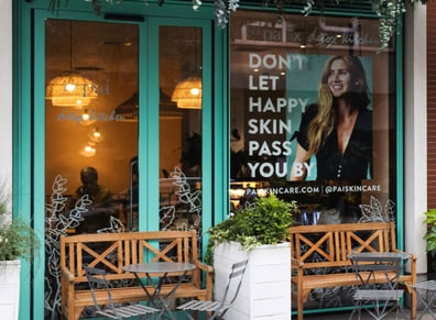 A large format print in a window for Pai Skincare