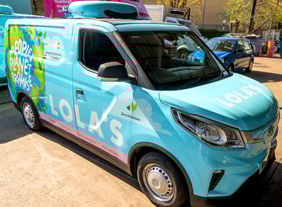 A blue van wrap for Lola's Cupcakes.