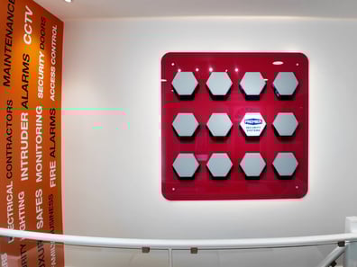 Foamex panel on the left, and glass interior signage as part of a showroom branding project.