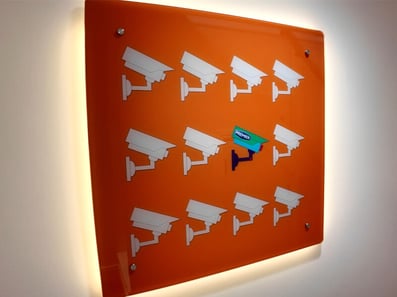 Interior signage for Premier Alarms, with backlighting, printed and installed by Raccoon.