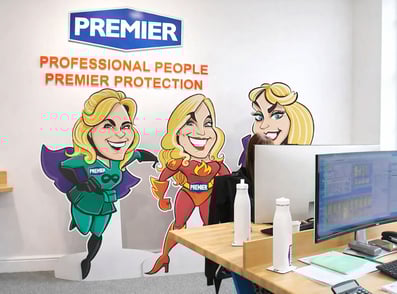 Branded signage in the office of Premier Alarms, by Raccoon.