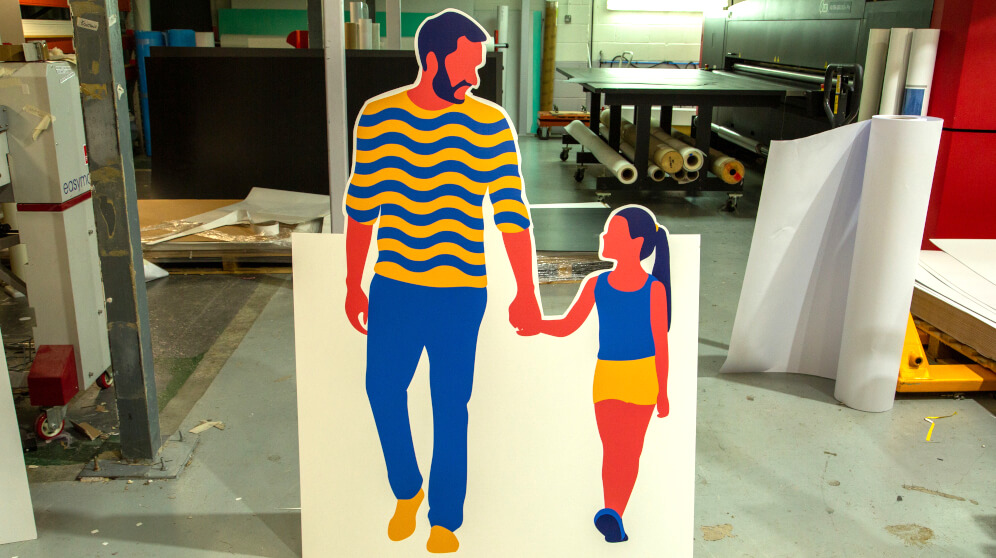 A sustainable display board cutout, pictured in a working print studio that's dedicated to green printing methods.
