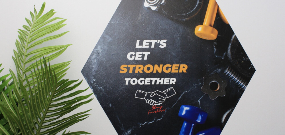 Large format graphics with a simple message, placed on a wall.