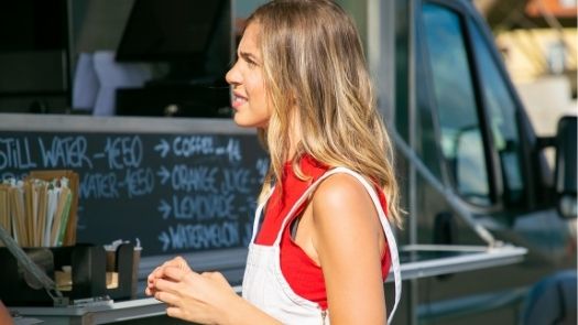 Food Truck Regulations/girl in front of food truck hatch