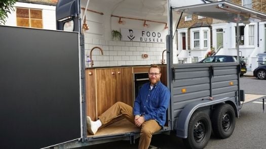 Food truck business planning - man sitting outside new food truck