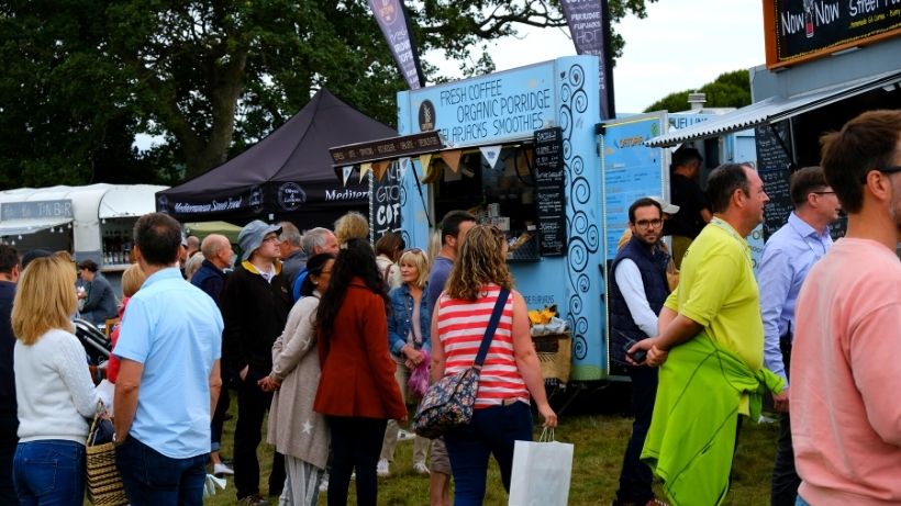 Food truck business ideas - people queuing for a food truck at event